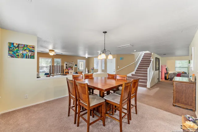 a dining room with furniture and window
