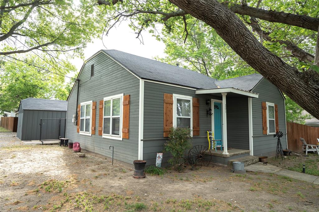 201 South Lane Street Decatur, TX 76234 - Photo 2 of 18 Side view with carport in back.