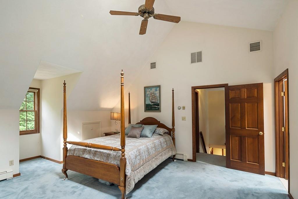 206 Prospect Street Carlisle, MA 01741 - Photo 16 of 25 a bedroom with a bed and a mirror