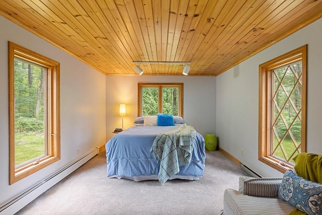 206 Prospect Street Carlisle, MA 01741 - Photo 18 of 25 a bed sitting in a spacious bedroom next to a window
