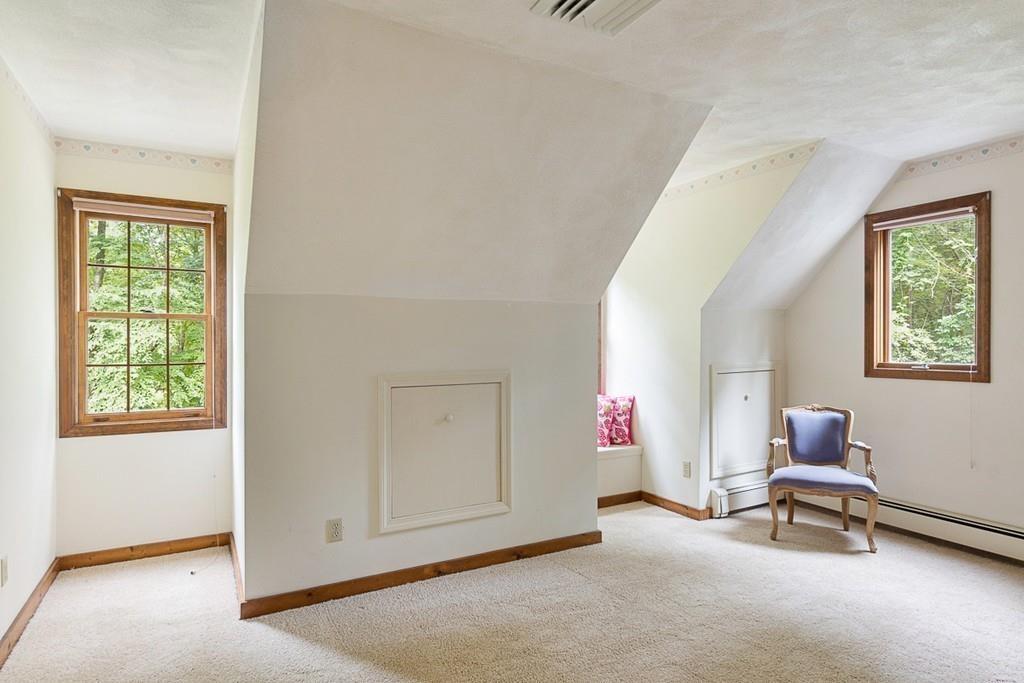 206 Prospect Street Carlisle, MA 01741 - Photo 19 of 25 a living room with furniture and a window