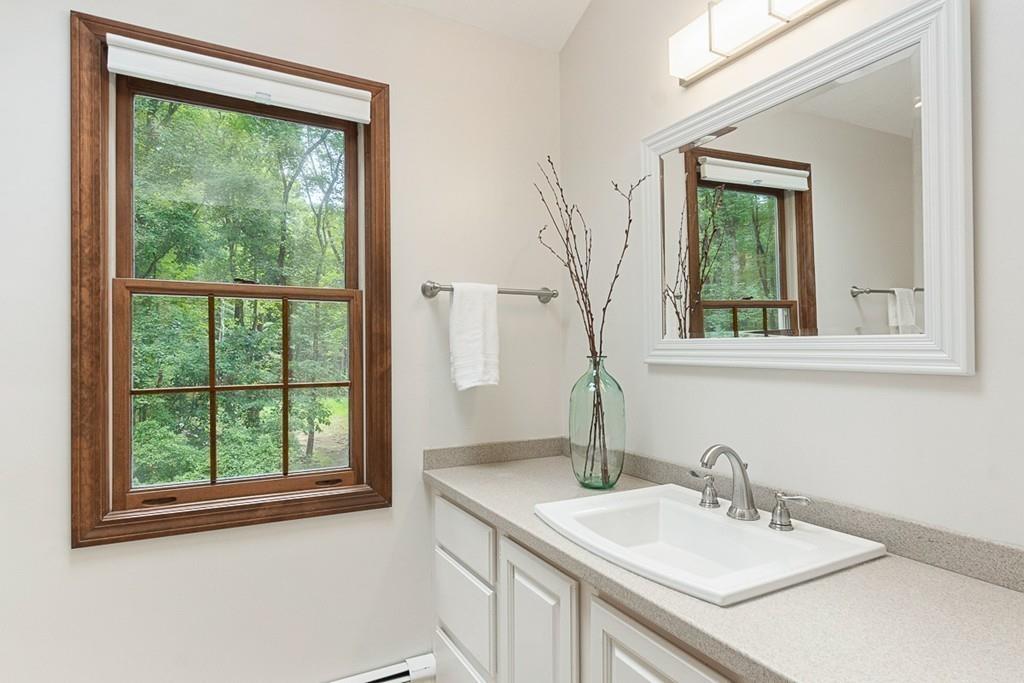 206 Prospect Street Carlisle, MA 01741 - Photo 21 of 25 a bathroom with a sink and a mirror