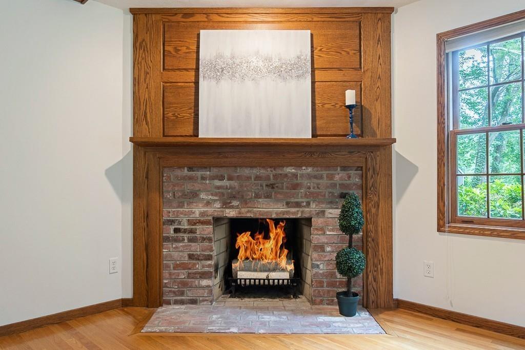 206 Prospect Street Carlisle, MA 01741 - Photo 9 of 25 a living room with furniture and a fireplace