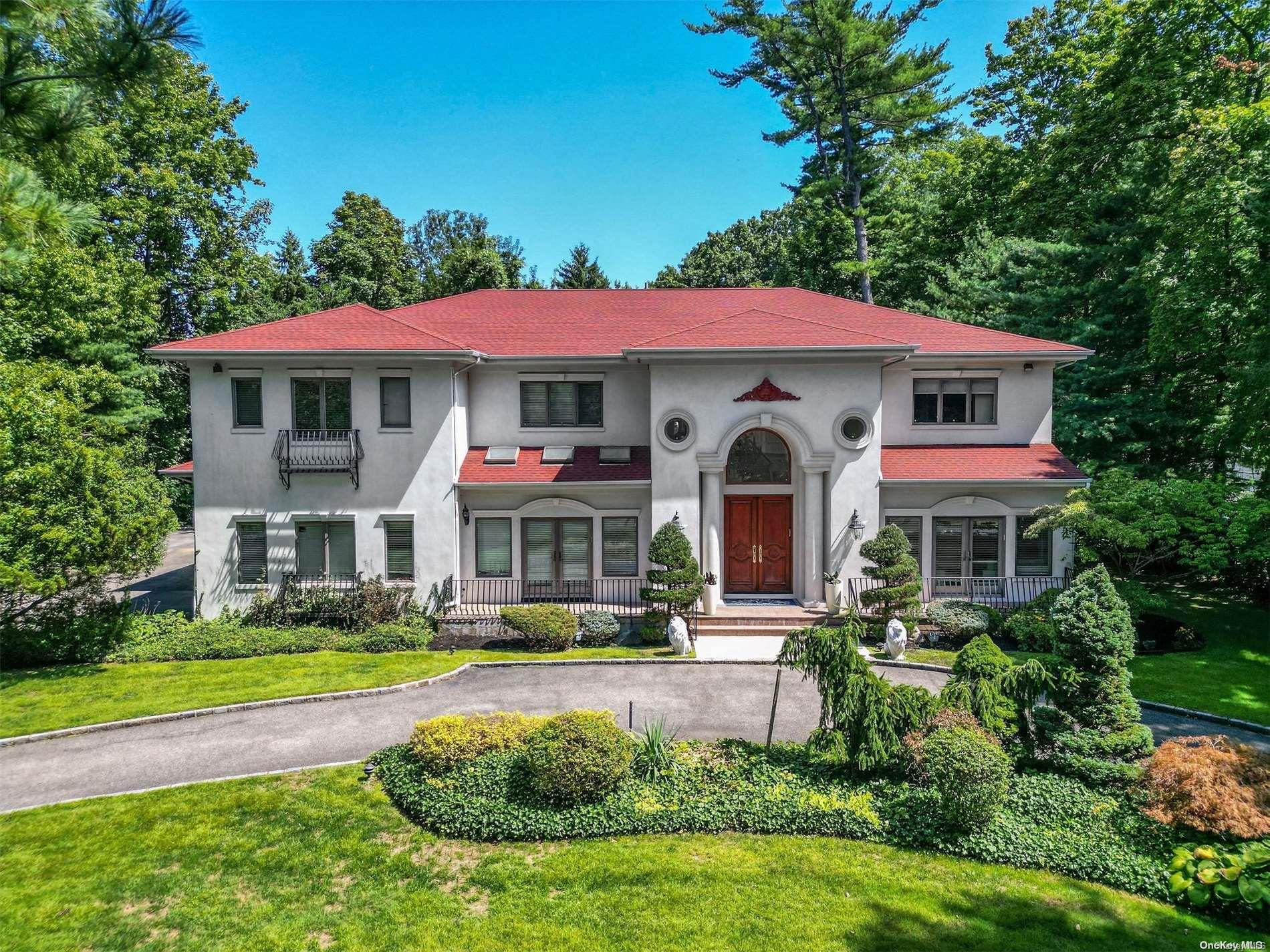 9 East Road Great Neck, NY 11024 - Photo 1 of 1 a front view of a house with swimming pool