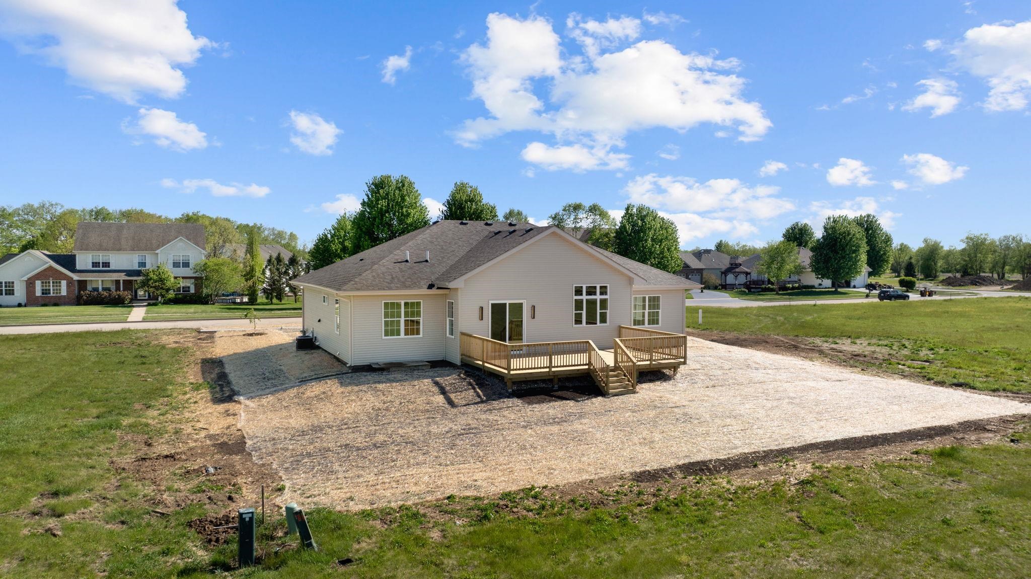 5145 Sycamore Ridge Road Belvidere, IL 61008 - Photo 2 of 57 a view of a house with a yard