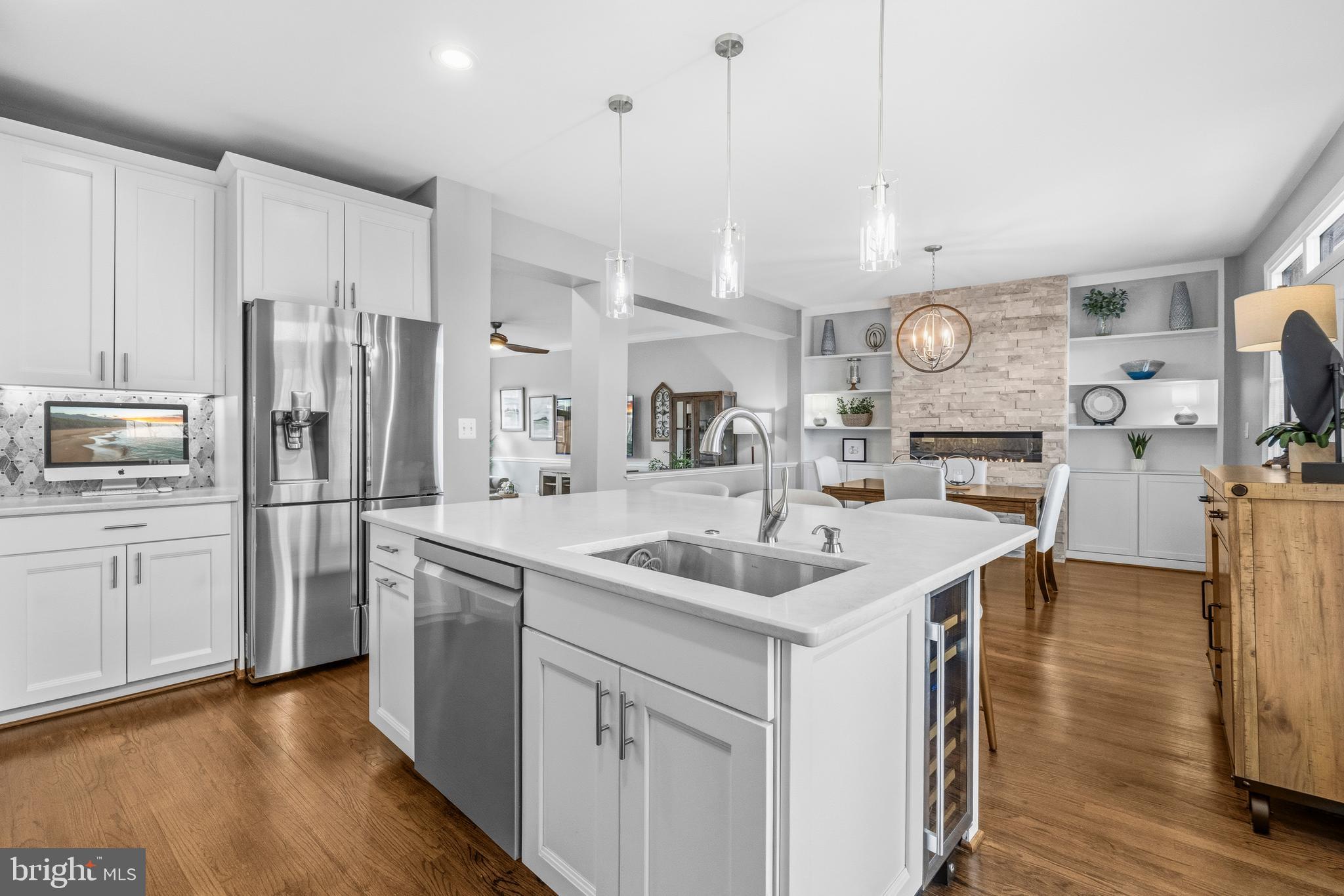12138 Chancery Station Circle Reston, VA 20190 - Photo 13 of 54 a kitchen with stainless steel appliances granite countertop a sink and refrigerator