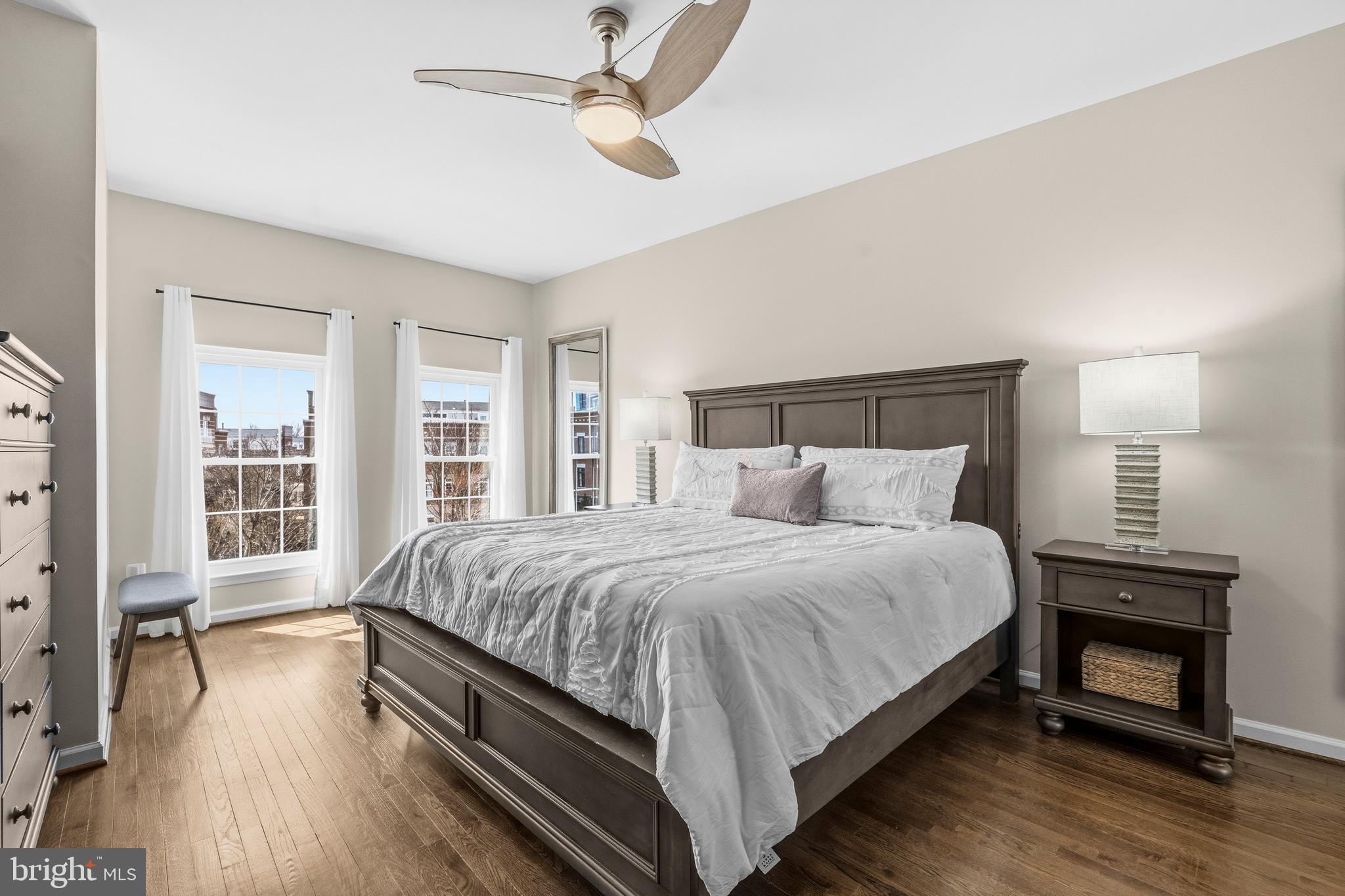 12138 Chancery Station Circle Reston, VA 20190 - Photo 23 of 54 a large bedroom with bed and wooden floor