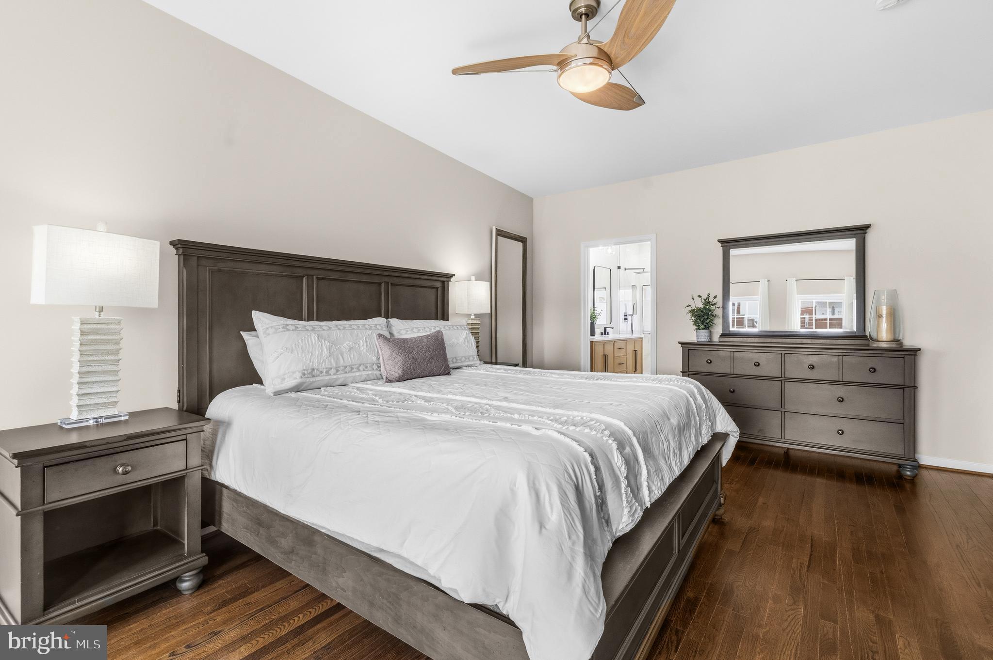 12138 Chancery Station Circle Reston, VA 20190 - Photo 25 of 54 a bedroom with a bed and a dresser