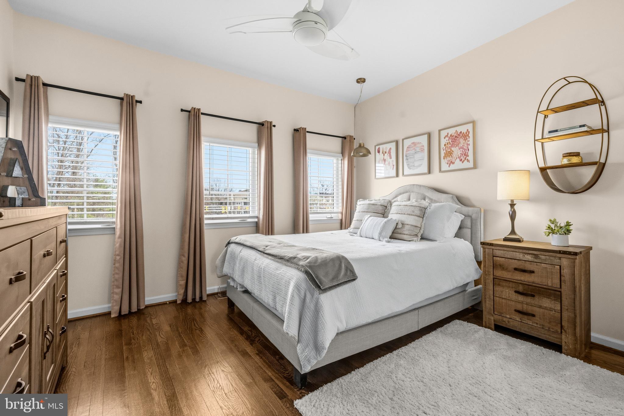 12138 Chancery Station Circle Reston, VA 20190 - Photo 27 of 54 a bedroom with a bed and a flat tv screen on dresser