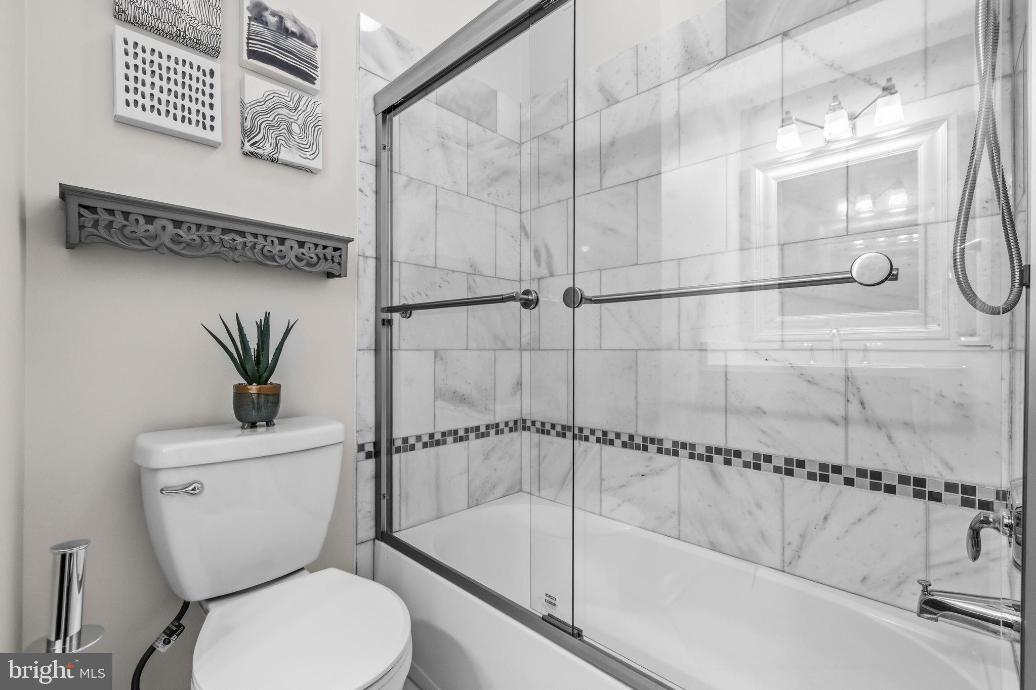 12138 Chancery Station Circle Reston, VA 20190 - Photo 30 of 54 a bathroom with a toilet and a shower