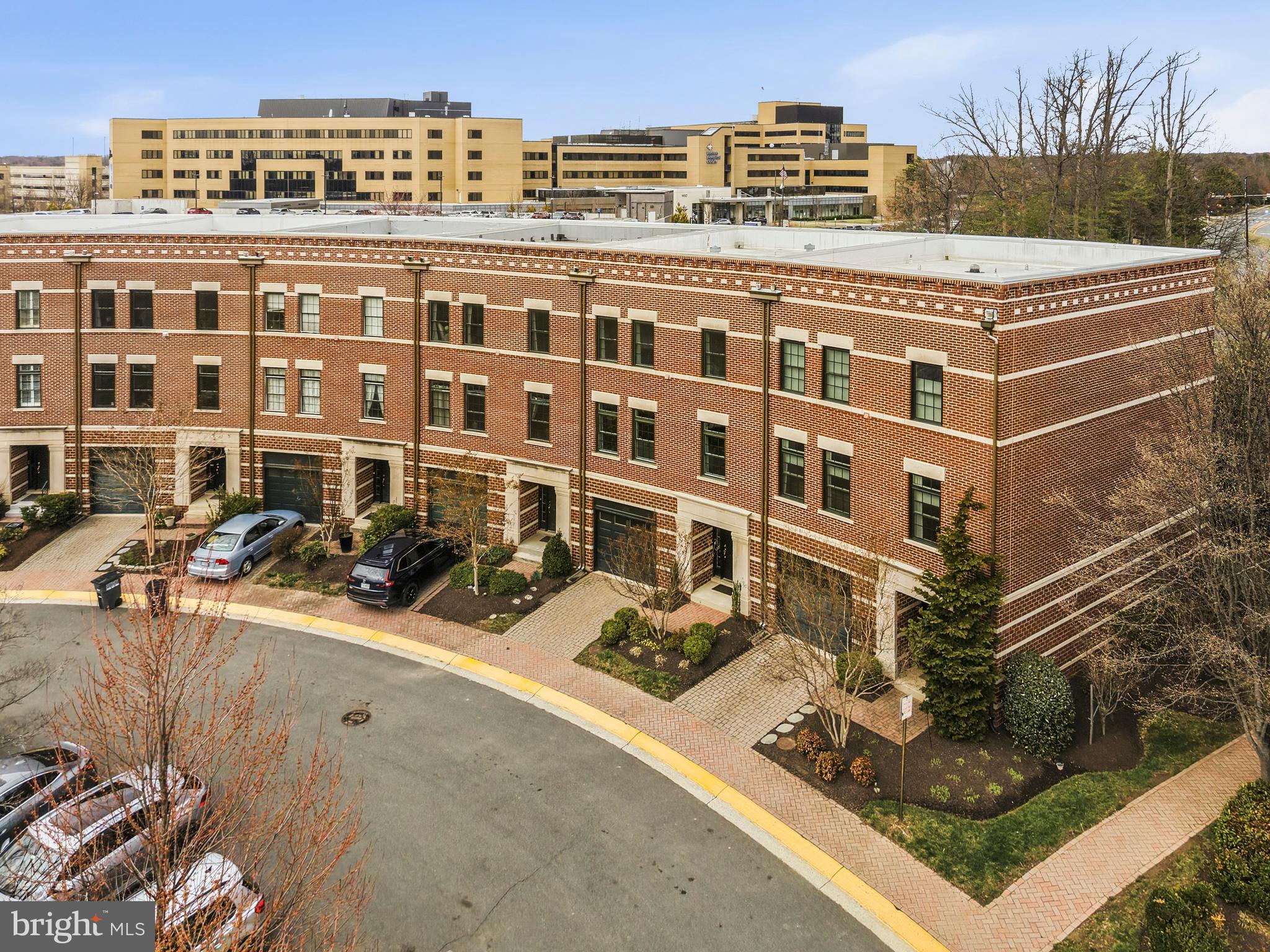 12138 Chancery Station Circle Reston, VA 20190 - Photo 3 of 54 a view of a building with cars parked