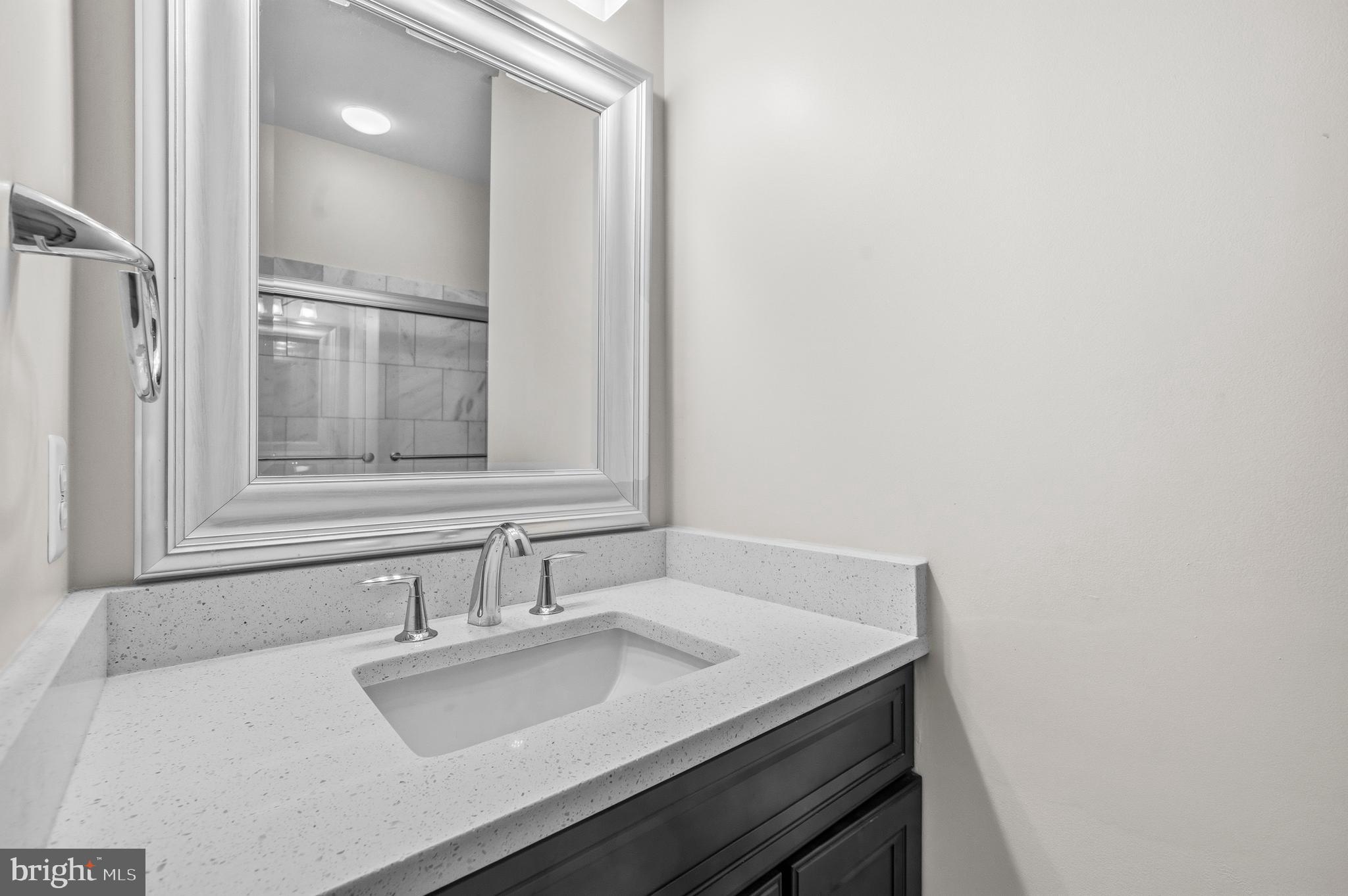 12138 Chancery Station Circle Reston, VA 20190 - Photo 31 of 54 a bathroom with a sink and a mirror