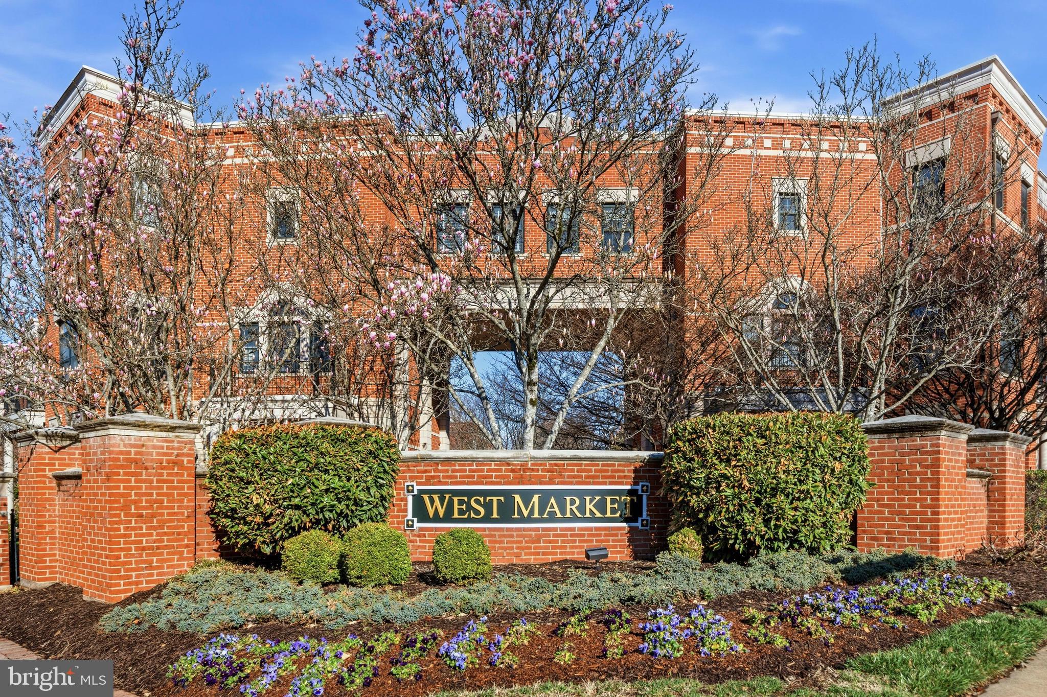 12138 Chancery Station Circle Reston, VA 20190 - Photo 34 of 54 a view of outdoor space with signage and flags