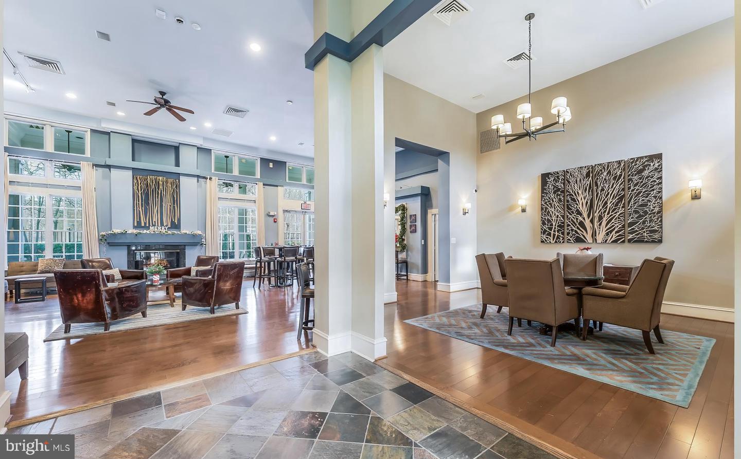 12138 Chancery Station Circle Reston, VA 20190 - Photo 37 of 54 a view of a dining room and livingroom with furniture wooden floor a chandelier