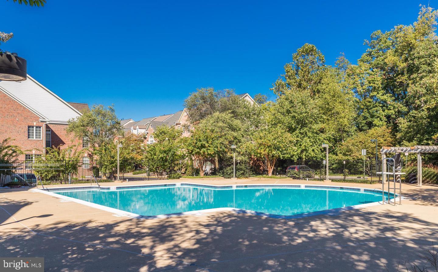 12138 Chancery Station Circle Reston, VA 20190 - Photo 41 of 54 a view of a swimming pool with a patio