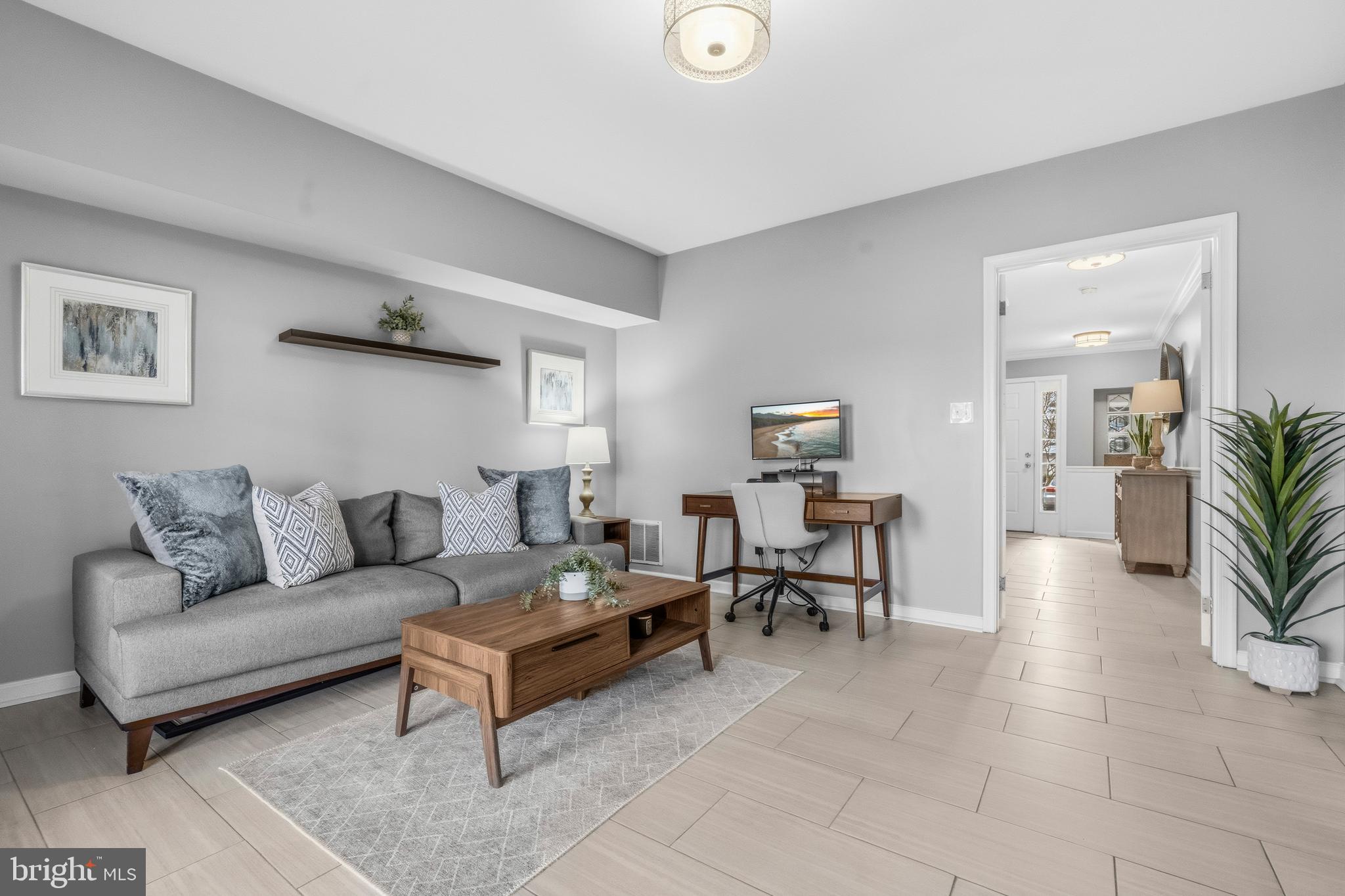 12138 Chancery Station Circle Reston, VA 20190 - Photo 5 of 54 a living room with furniture and a table