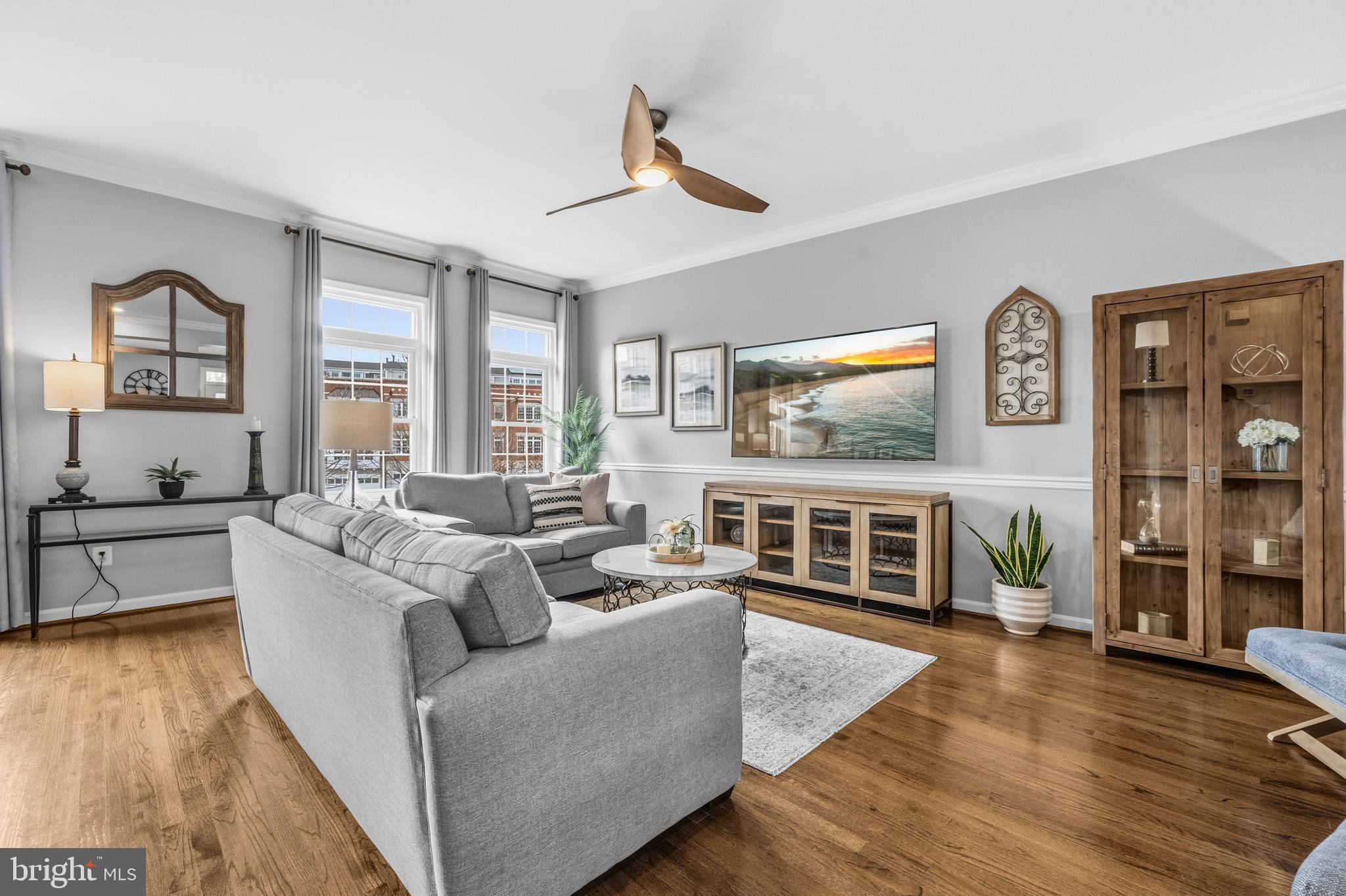 12138 Chancery Station Circle Reston, VA 20190 - Photo 8 of 54 a living room with furniture and a flat screen tv