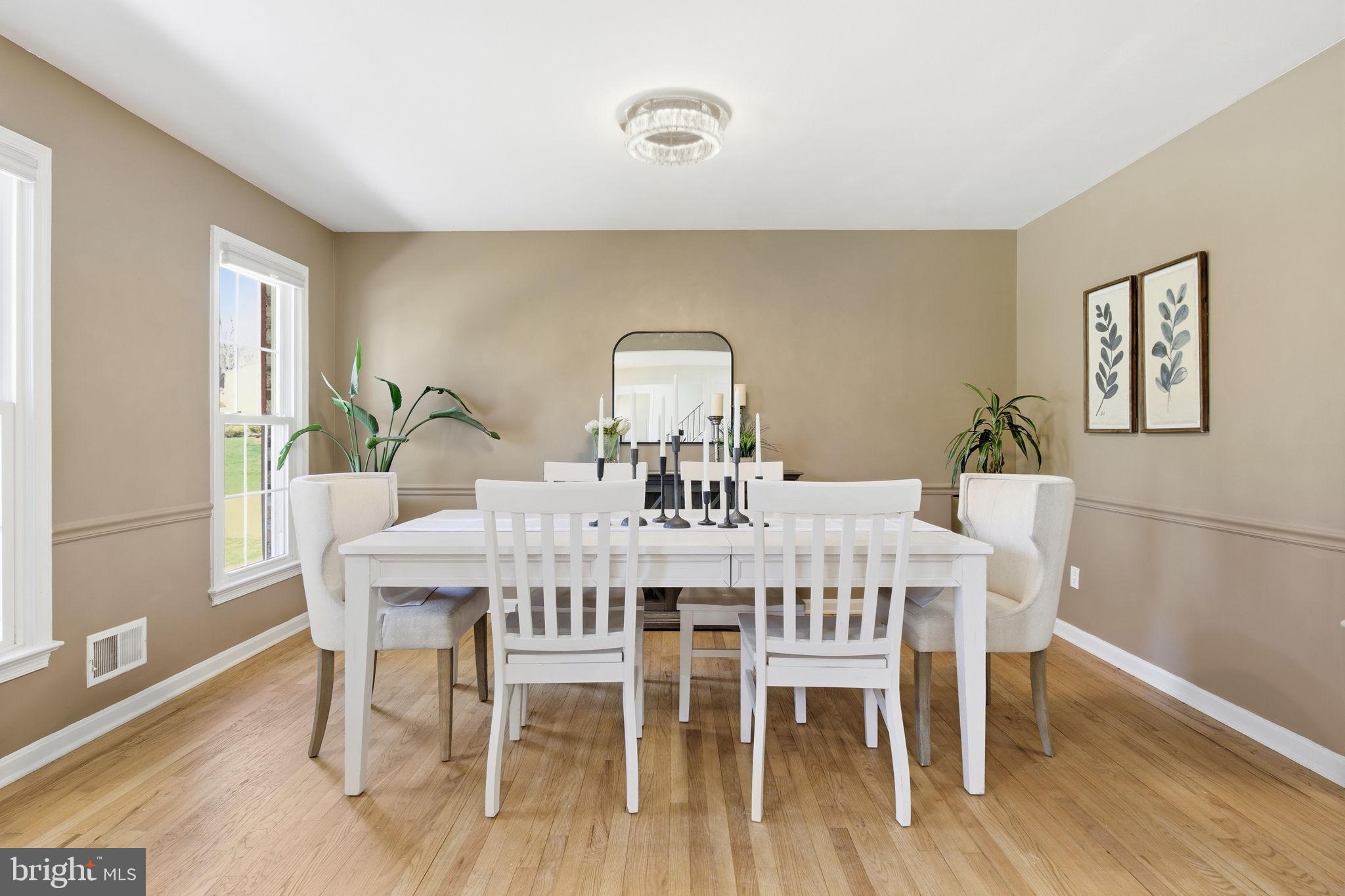 15101 Redgate Drive Silver Spring, MD 20905 - Photo 4 of 39 a view of a dining room with furniture and wooden floor