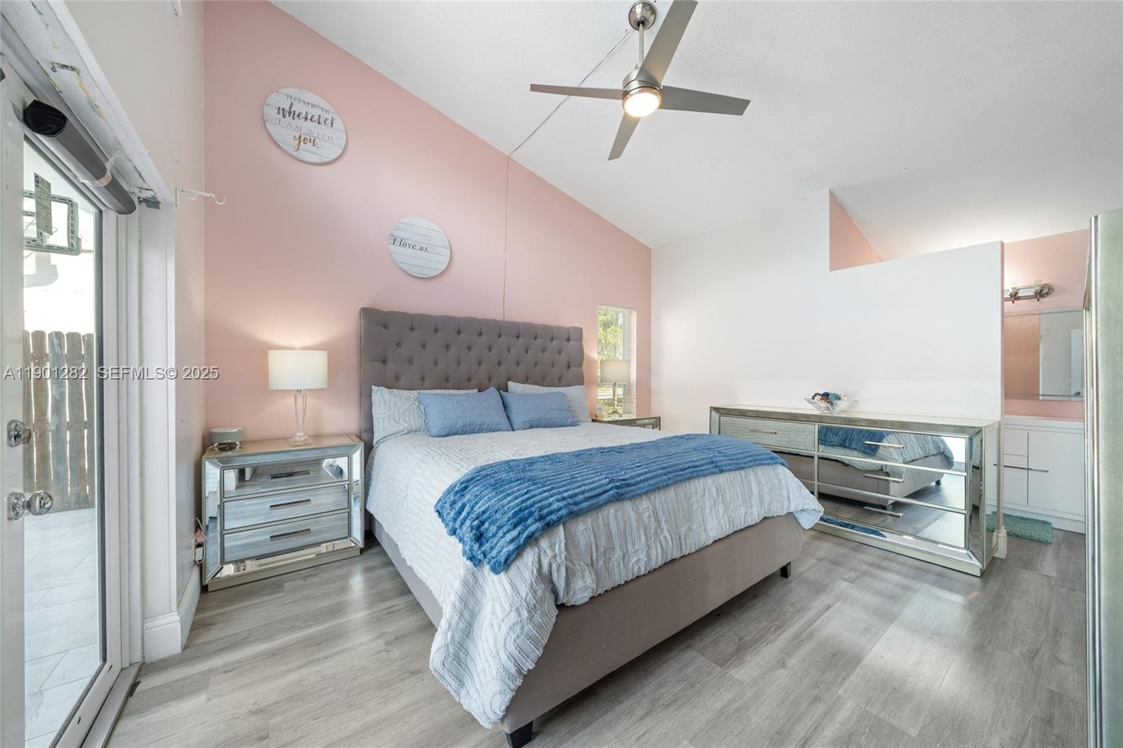 7461 Northwest 36th Street Lauderhill, FL 33319 - Photo 14 of 24 a bedroom with a bed and wooden floor