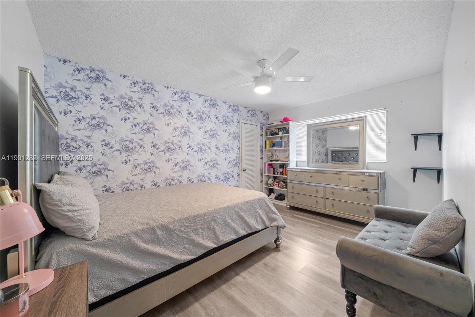 7461 Northwest 36th Street Lauderhill, FL 33319 - Photo 18 of 24 a spacious bedroom with a bed couch and a window