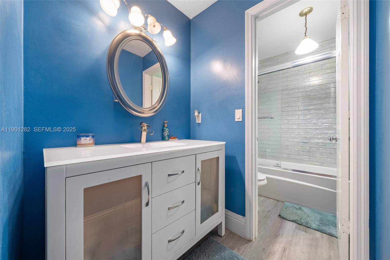 7461 Northwest 36th Street Lauderhill, FL 33319 - Photo 19 of 24 a bathroom with a sink and a mirror