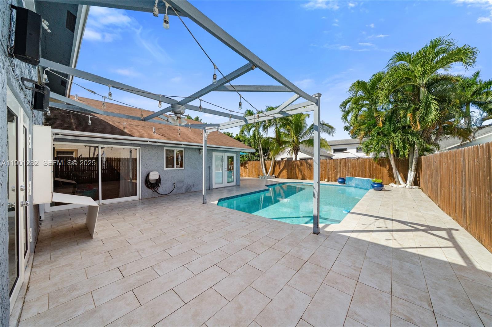 7461 Northwest 36th Street Lauderhill, FL 33319 - Photo 22 of 24 a view of a house with a patio