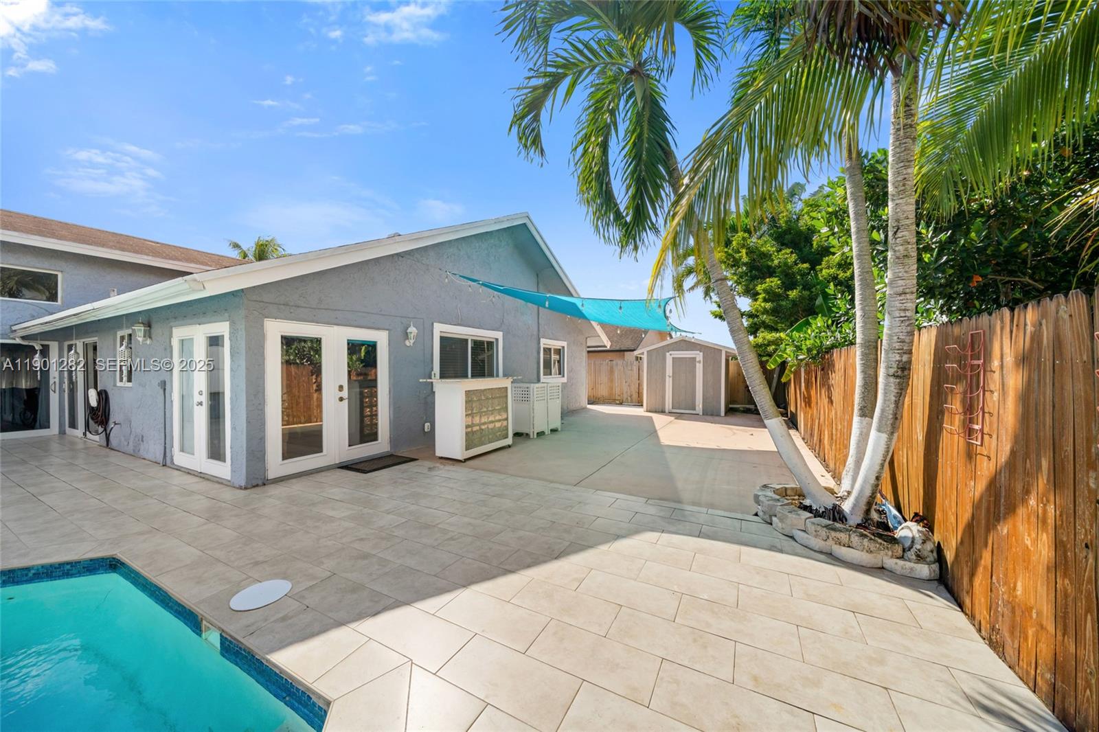 7461 Northwest 36th Street Lauderhill, FL 33319 - Photo 23 of 24 a view of a house with backyard and a tree
