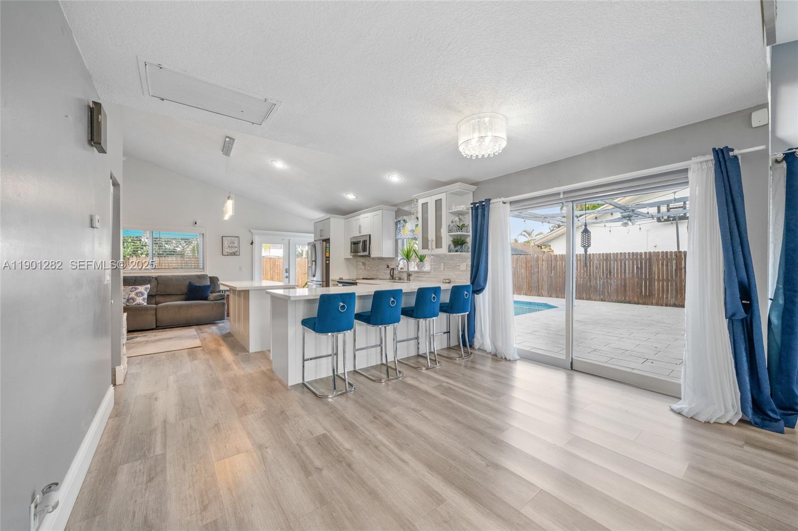 7461 Northwest 36th Street Lauderhill, FL 33319 - Photo 6 of 24 a living room with furniture and a large window