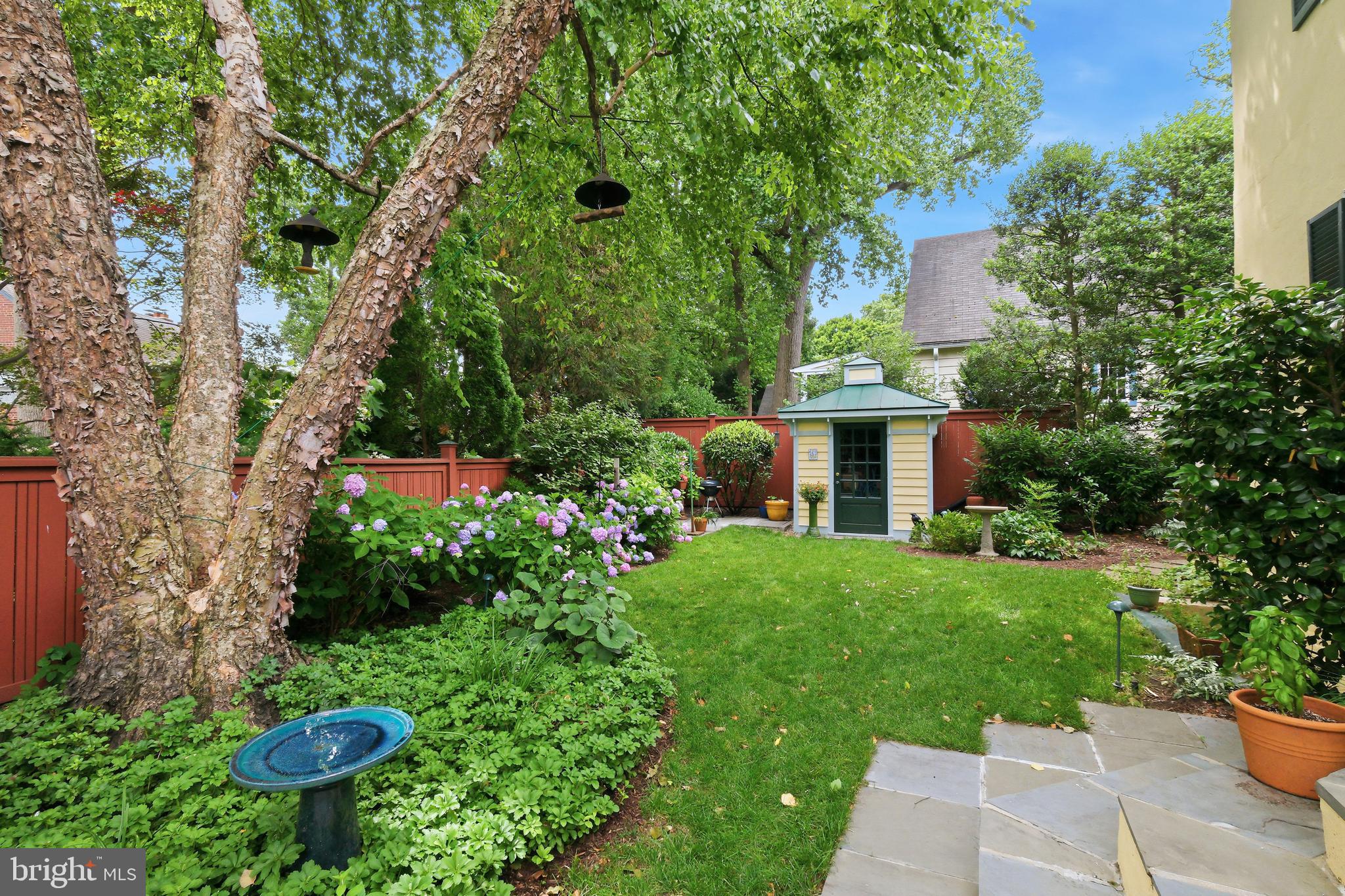 6411 33rd Street Northwest Washington, DC 20015 - Photo 39 of 48 a view of a garden with a fountain