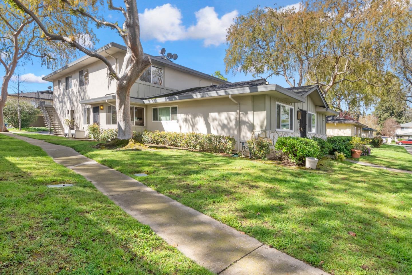a front view of a house with garden