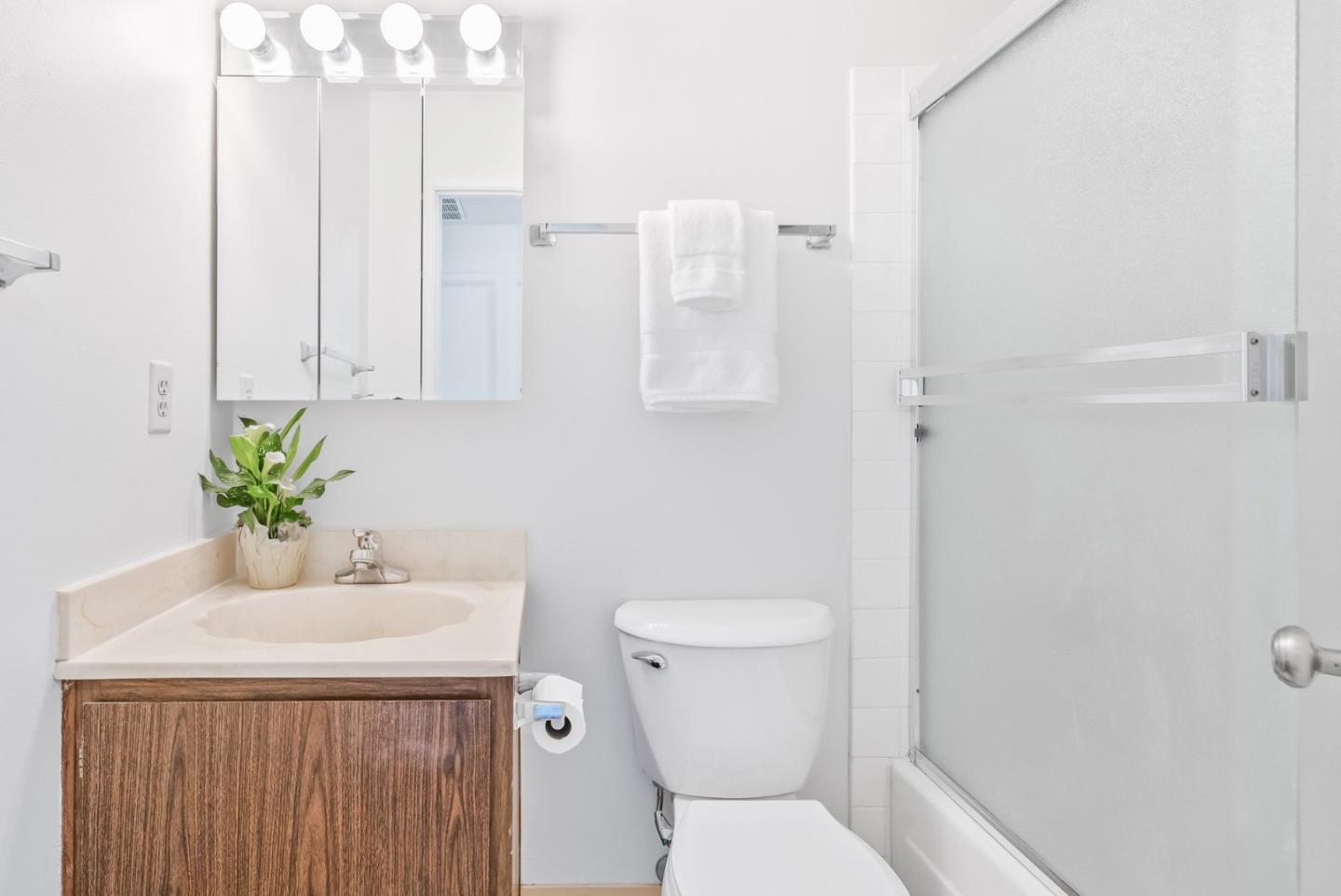 220 Watson Drive, Unit 2 Campbell, CA 95008 - Photo 20 of 34 a bathroom with a sink a toilet and a mirror