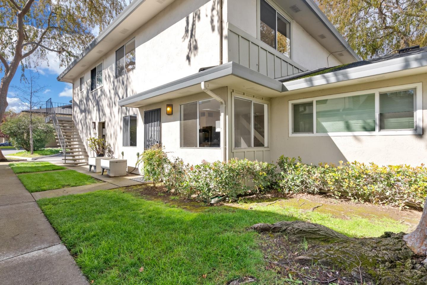 220 Watson Drive, Unit 2 Campbell, CA 95008 - Photo 2 of 34 a front view of a house with garden