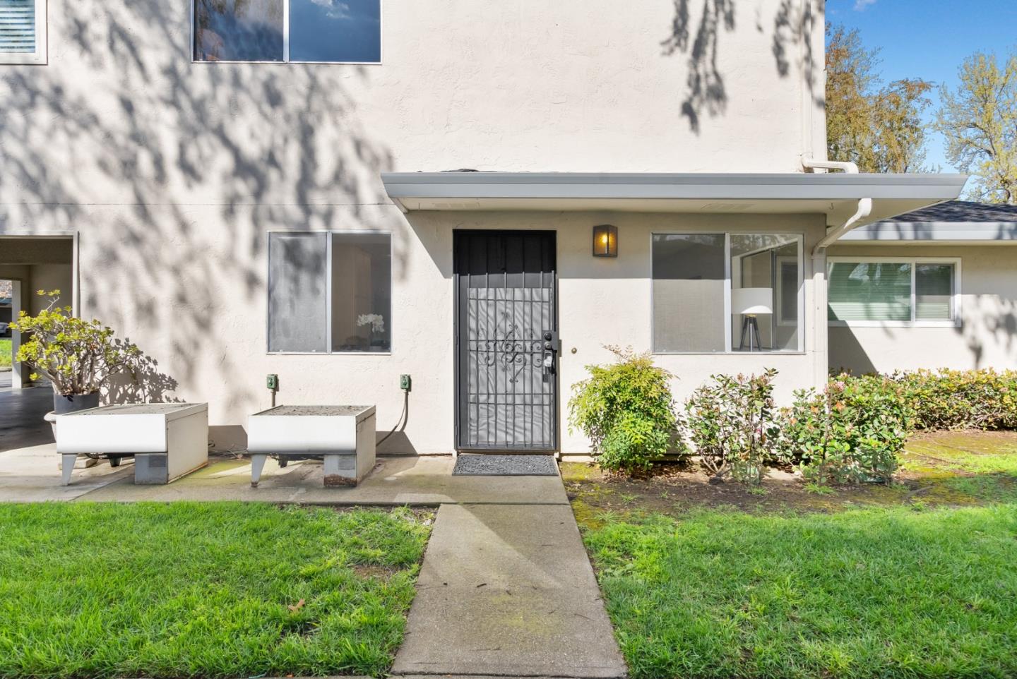 220 Watson Drive, Unit 2 Campbell, CA 95008 - Photo 3 of 34 a front view of a house with garden