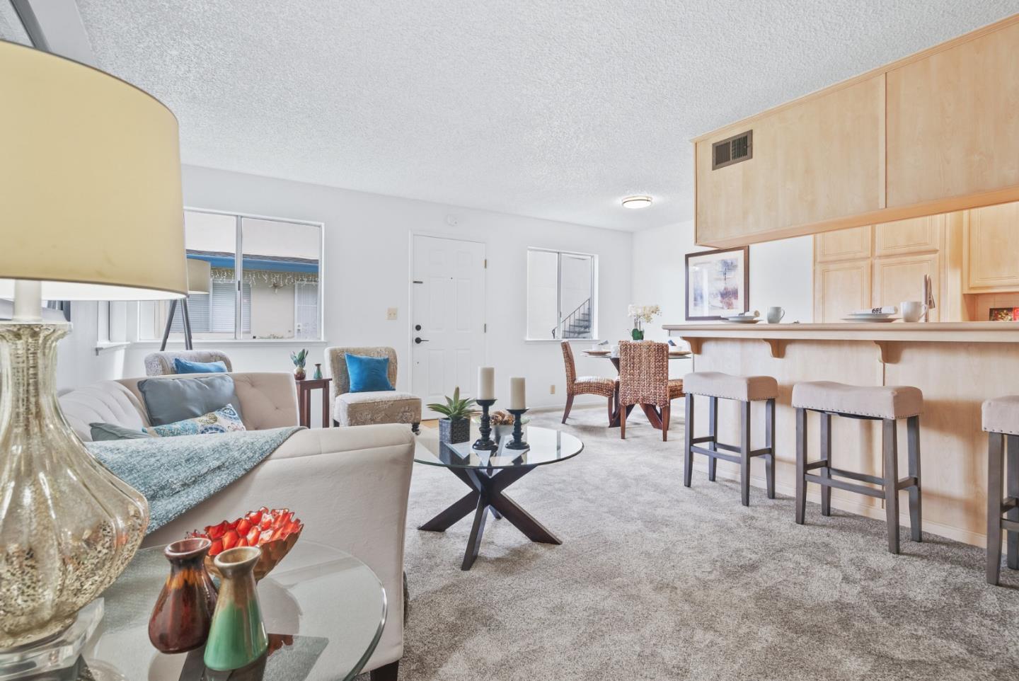 220 Watson Drive, Unit 2 Campbell, CA 95008 - Photo 7 of 34 a living room with furniture and a kitchen appliance view