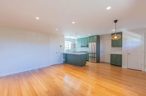 a view of a kitchen with a sink and cabinets