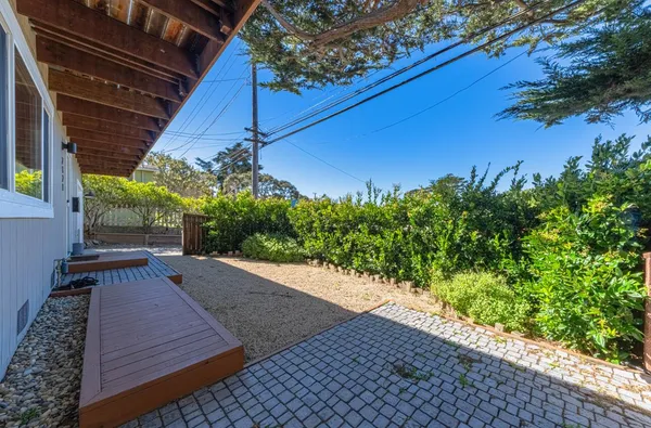 a view of a backyard with seating area