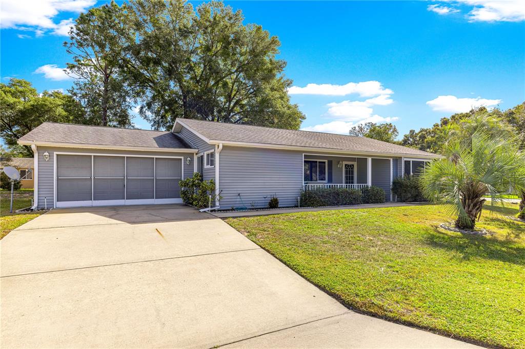 10987 Southwest 86th Terrace Ocala, FL 34481 - Photo 1 of 40 a house with swimming pool in front of it