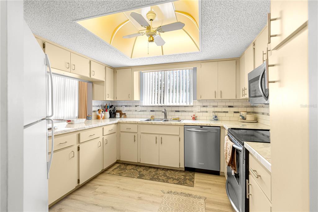 10987 Southwest 86th Terrace Ocala, FL 34481 - Photo 15 of 40 a kitchen with a sink cabinets and window