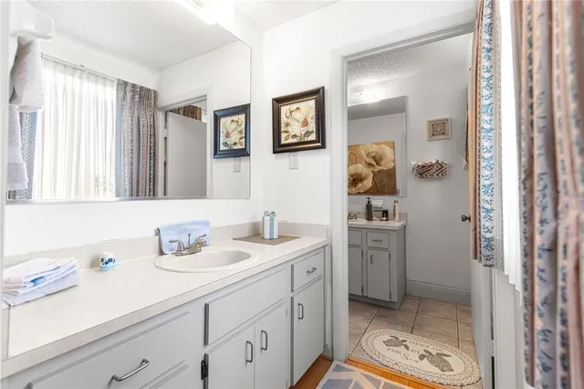 a bathroom with a sink double vanity and a mirror