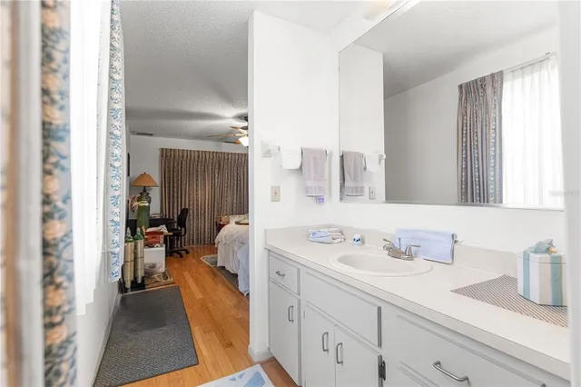 a en suite bathroom with a sink and a mirror