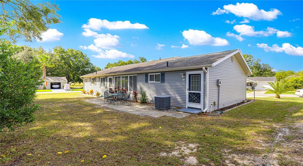 10987 Southwest 86th Terrace Ocala, FL 34481 - Photo 28 of 40 a view of a house with backyard and sitting area