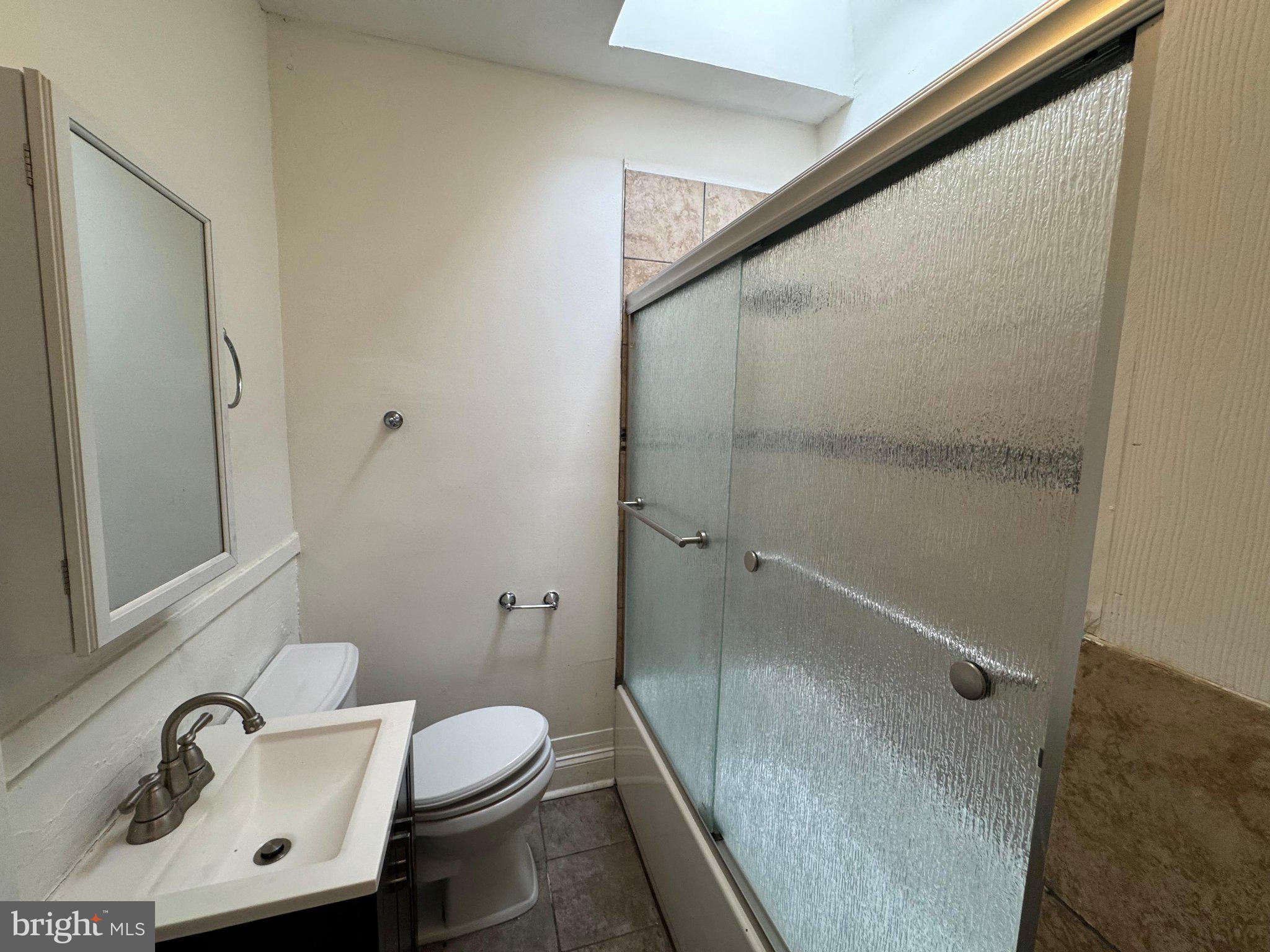 707 Denison Street Baltimore, MD 21229 - Photo 7 of 18 Bright and airy bathroom retreat.