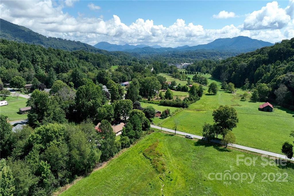 0 Green Valley Road Waynesville, NC 28786 - Photo 13 of 20 an aerial view of a house with yard green space and mountain view in back