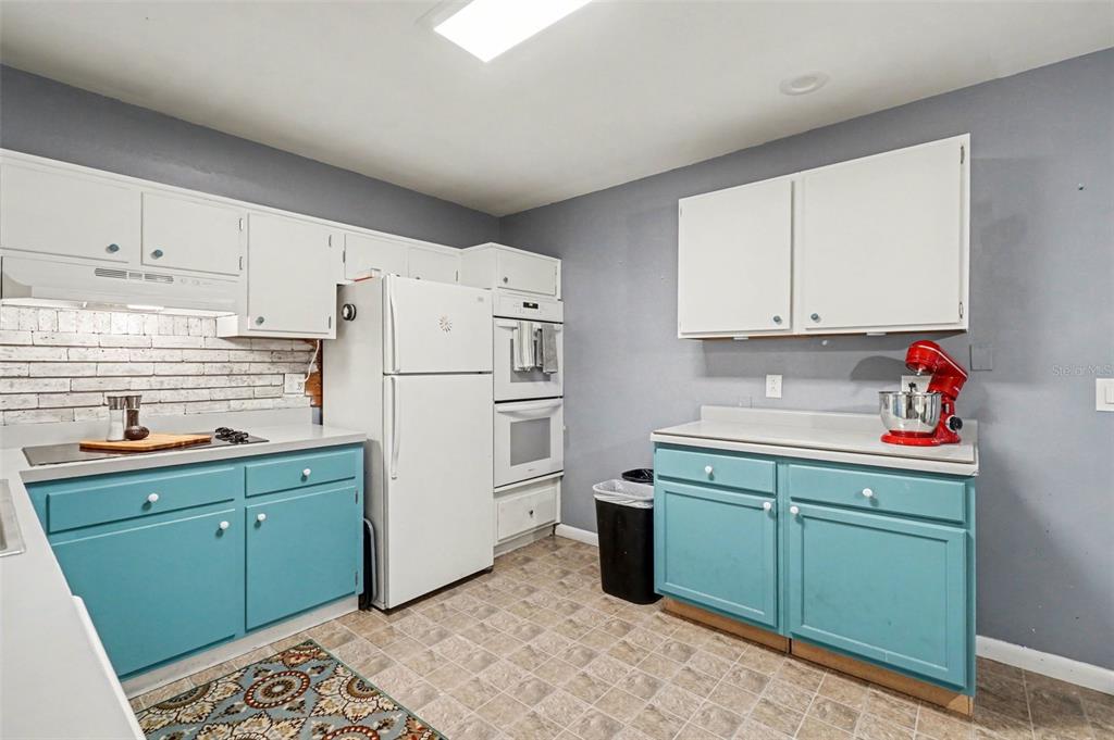 2300 Lake Road Fern Park, FL 32730 - Photo 13 of 25 a kitchen with a sink cabinets and refrigerator