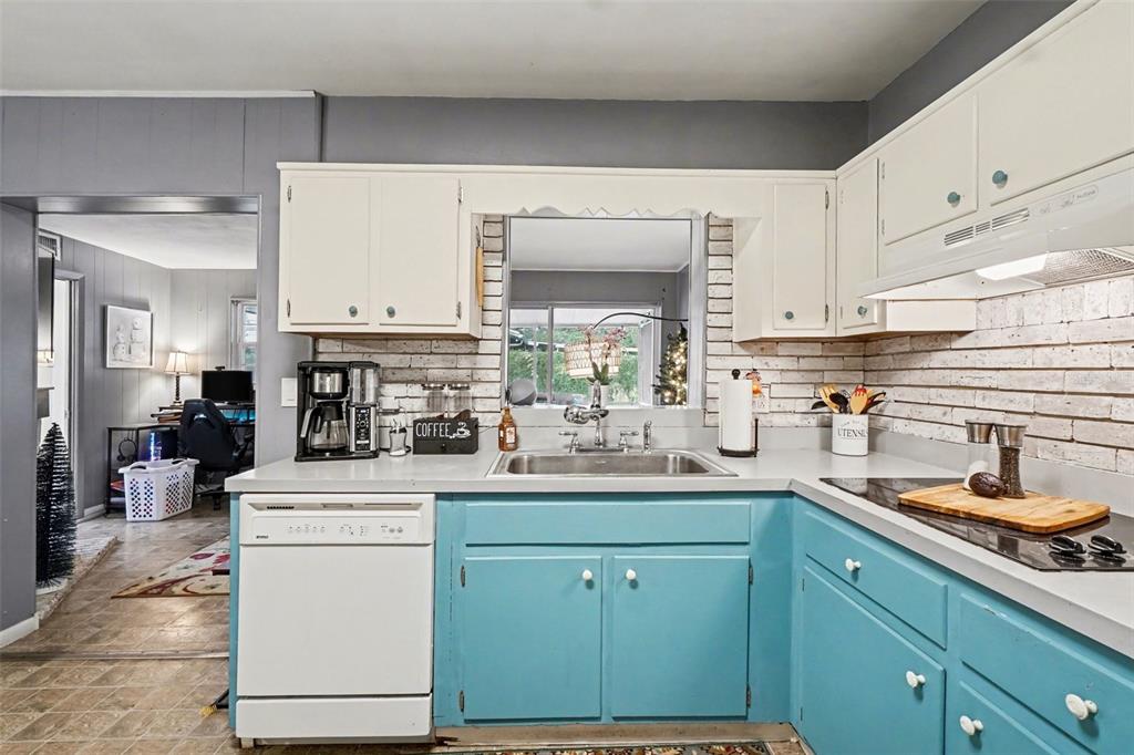 2300 Lake Road Fern Park, FL 32730 - Photo 14 of 25 a kitchen with a sink stove and cabinets