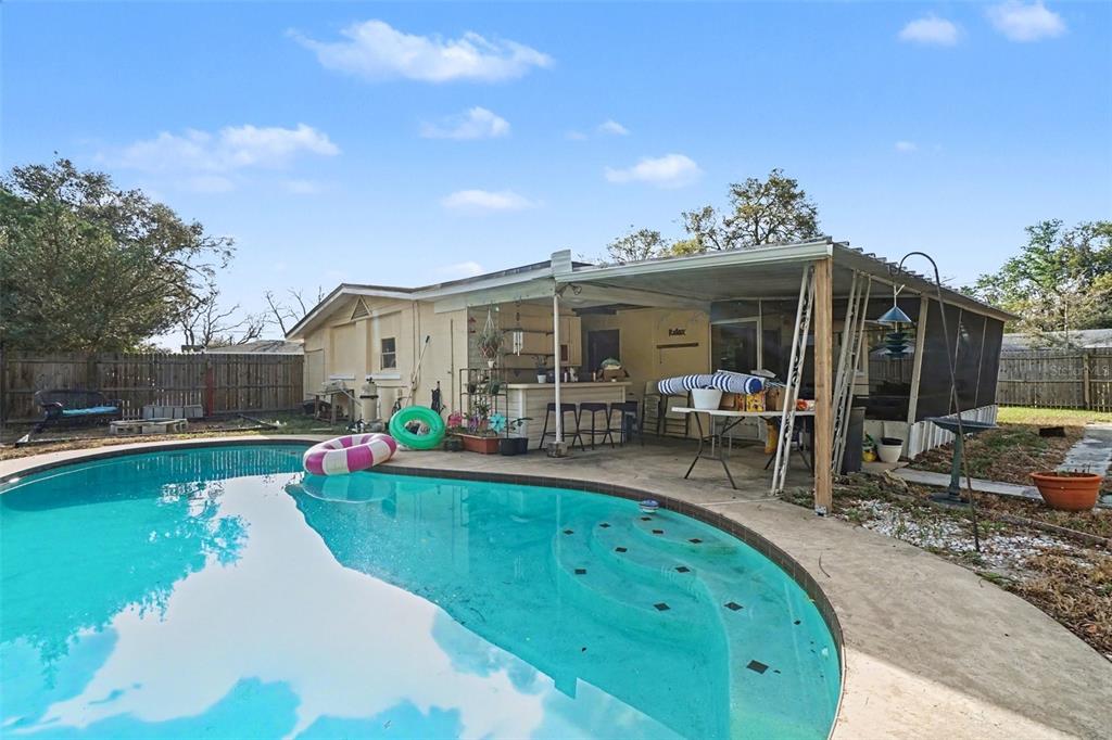 2300 Lake Road Fern Park, FL 32730 - Photo 23 of 25 a view of a house with backyard porch and furniture
