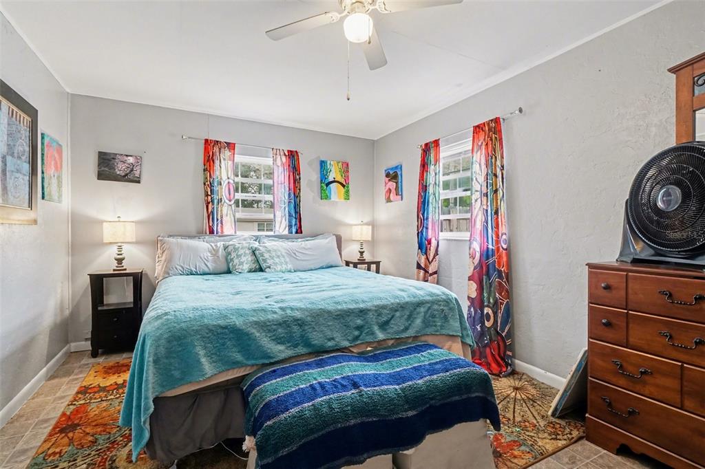 2300 Lake Road Fern Park, FL 32730 - Photo 4 of 25 a bedroom with a bed and a chandelier