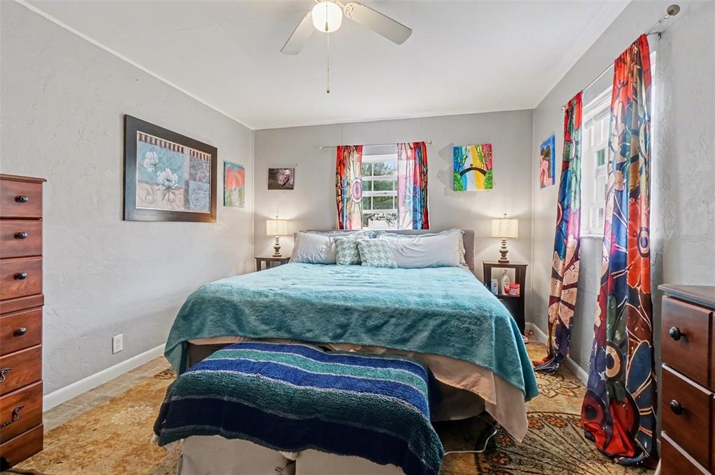 2300 Lake Road Fern Park, FL 32730 - Photo 6 of 25 a bedroom with a bed and a painting on the wall