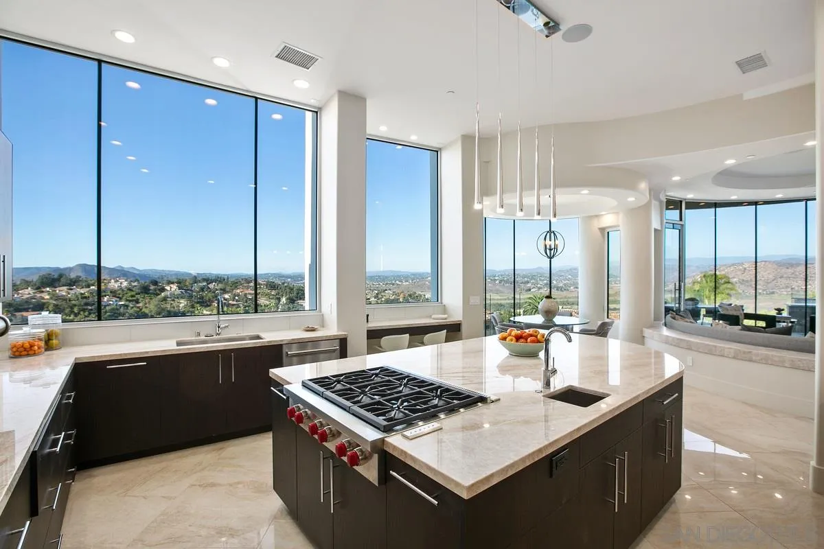 13220 Highlands Ranch Road Poway, CA 92064 - Photo 6 of 12 a kitchen with a large window and a table in it