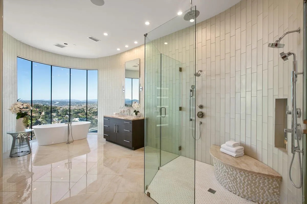 13220 Highlands Ranch Road Poway, CA 92064 - Photo 9 of 12 a bathroom with a tub shower and sink